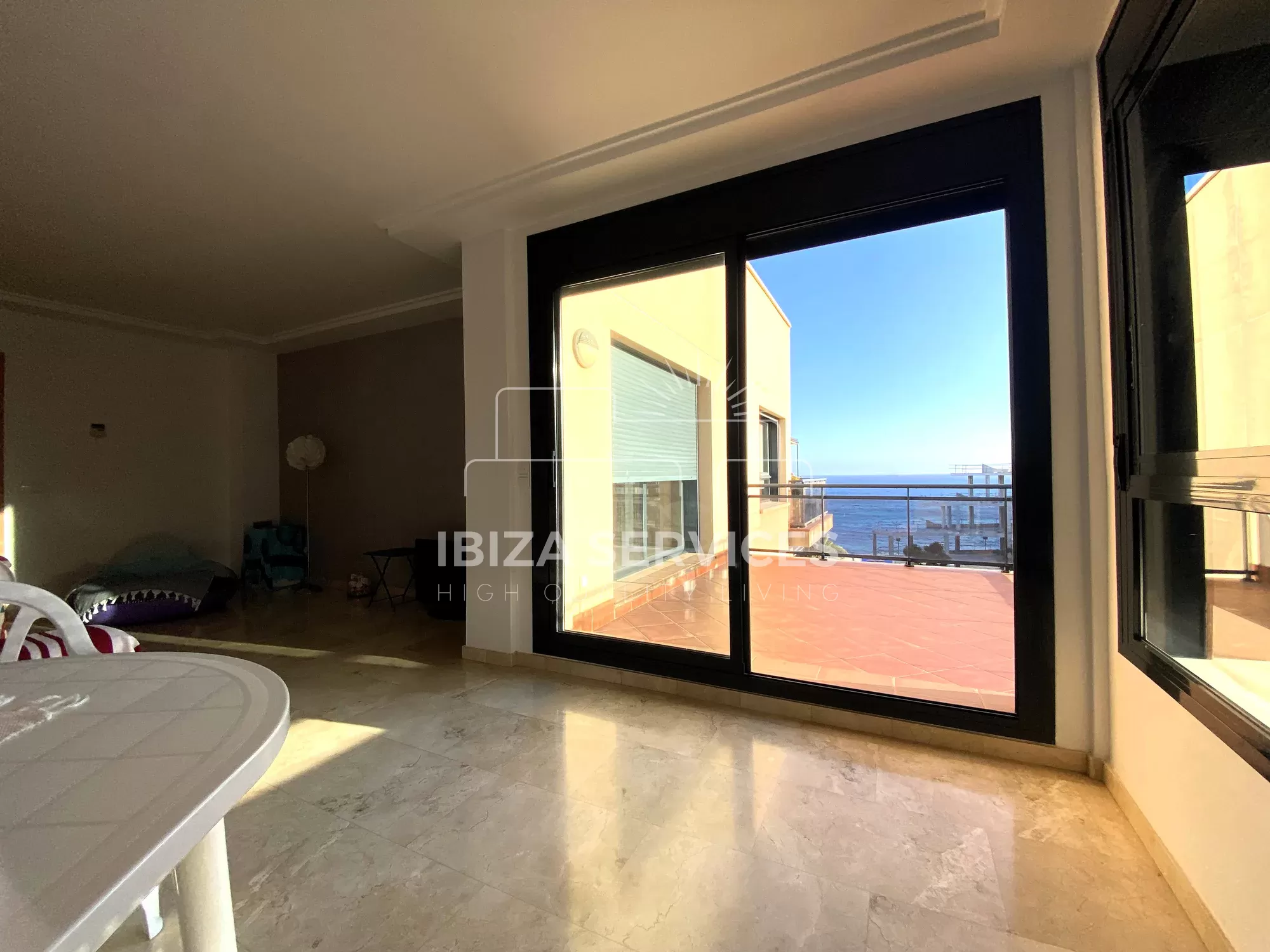 Buy a penthouse in nearby Playa d’en Bossa with sea view.